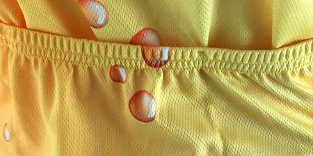 The elasticated back pocket of a yellow sublimated cycling shirt